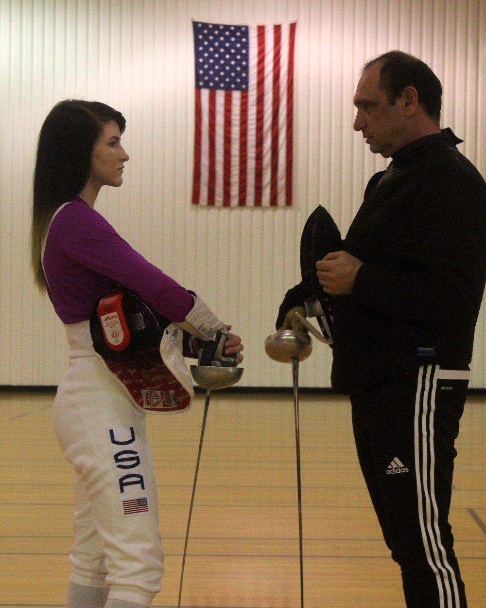 Coach Khariton Zazhitskiy with a fencer at the salle