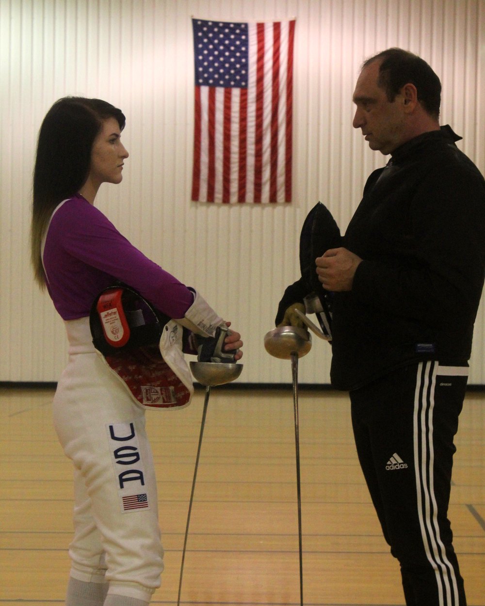 Khariton Zazhitskiy fencing in a USA jacket at the salle
